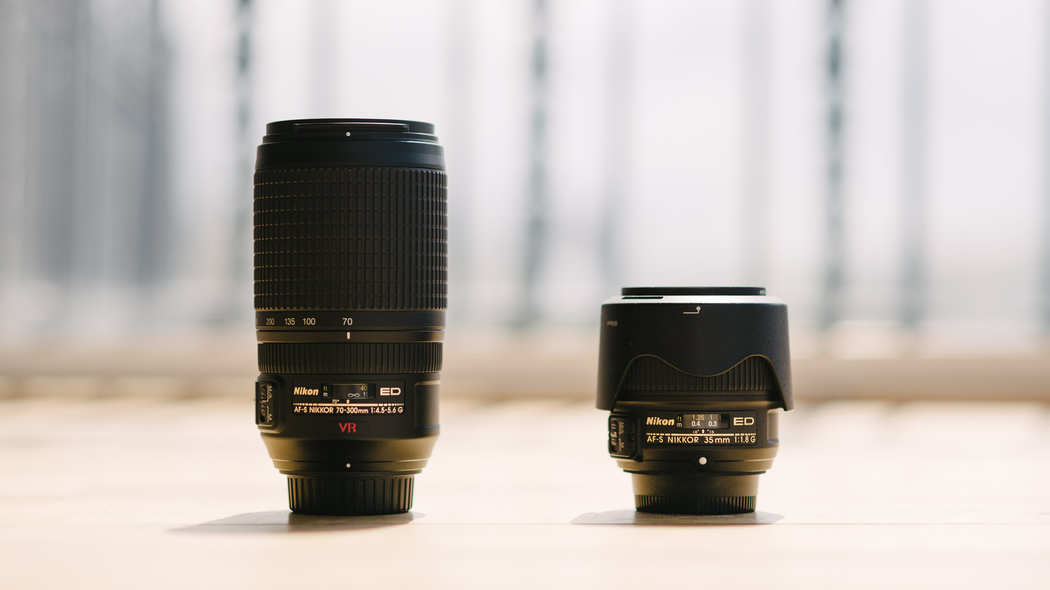 two lenses for full-frame cameras: nikkor 70-300mm f/4.5-5.6 and nikkor 35mm f/1.8
